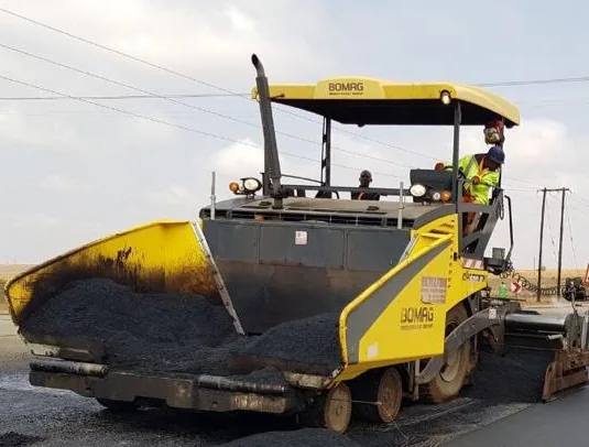 Asphalt paving machinery on a road project