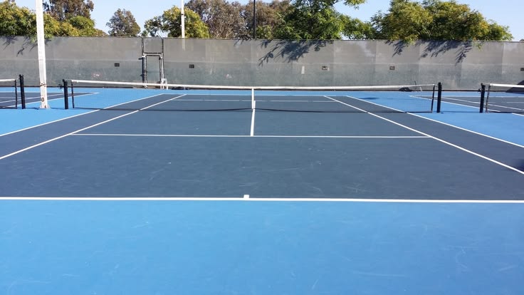 Blue tennis court with white markings